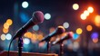 © PrettyVectors - Press conference with microphones and podium. Blurred bokeh background