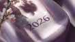 © S.Jirut - Sunlit shadow of 2026 numerals on lavender kimono silk, minimalist floral motif with sharp silhouette lighting, elegant editorial composition for commercial use
