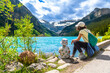 © unai - Mother and child admiring lake louise in banff national park