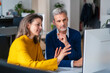© Westend61 - Businesswoman sharing ideas at office