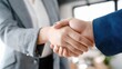 © WS Studio 1985 - Handshake Deal: A close-up of two individuals in professional attire clasping hands in a firm handshake, symbolizing a successful partnership, agreement, or greeting.
