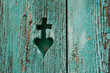 © Westend61 - Carved cross and heart symbol in weathered painted wood Austria