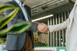 © Westend61 - Businessman and businesswoman shaking hands during office meeting