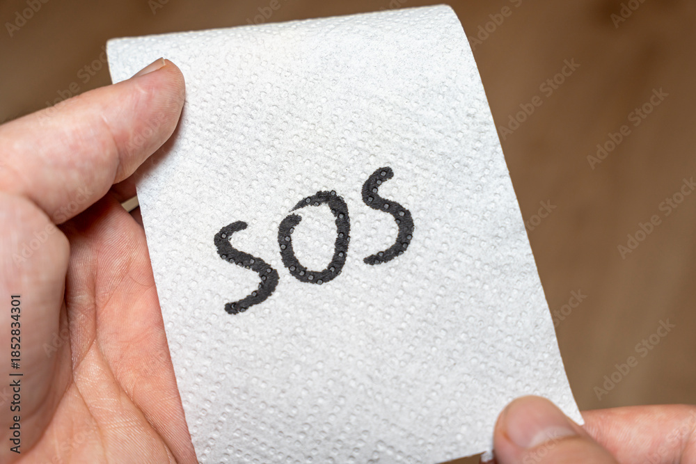 Send Help Handwritten Sign Handwritten SOS message on a paper towel conveys urgency and a call for ...
