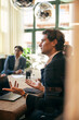 © Maskot - Male law professional discussing business strategies with colleagues in meeting at board room