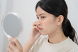 © Shisu_ka - Young woman asian are worried about faces Dermatology and allergic to steroids in cosmetics. sensitive skin, red face from sunburn, acne, allergic to chemicals, rash on face. skin problems and beauty