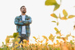 © Serhii - Farmer standing with crossed arms in soy field at sunset