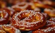 © SanyBRZ - Freshly baked golden-brown pretzels with sea salt, deep warm hues, high-detail food photography, soft natural lighting, crispy and delicious snack composition
