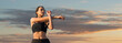 © Mountains Hunter - A young slim athletic girl in sportswear performs a set of exercises. Fitness and healthy lifestyle.