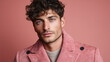 © Marut - Matte velvety male texture with structured masculine features, curly hair, blue eyes, and pink corduroy jacket on soft pink background, showing confident and calm expression