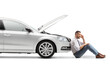 © Ljupco Smokovski - Stressed man sitting near broken car with open hood