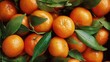 © Ірина Пальцева - A pile of fresh oranges with green leaves creates a vibrant, healthy, and appealing image, showcasing the natural beauty of citrus fruits in a close-up composition.