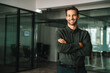 © Stock 4 You - Handsome latin hispanic investor specialist business man employee smiling at camera. Portrait of European confident young middle age student, ceo trader businessman standing crossed arms in office