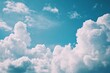 © mehaniq41 - White clouds scattered across vibrant blue sky evoke tranquility. Clear day and bright colors enhance serene atmosphere. Neural network AI generated