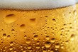 © mehaniq41 - Close-up of golden beer with frothy white foam and effervescent bubbles. Vivid contrast highlights texture and freshness. Warm lighting. Neural network AI generated