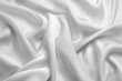 © mehaniq41 - Luxurious creamy fabric forms elegant folds on solid white background, creating soothing visual flow under soft lighting. Neural network AI generated