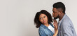 © Prostock-studio - Coronavirus Precautions. Disgusted African Woman Pushing Away Her Boyfriend, Refusing His Kisses, Afraid Of Respiratory Infection, Light Background