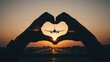 © AGUNG - Hands frame plane silhouette against sunset, creating heart shape over runway