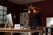 © Pixel-Shot - Angry businessman throwing chair at desk in office