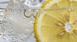 © Mst - Sparkling water macro shot with fresh lemon slices and ice cubes in glass carbonated beverage with bubbles refreshing summer drink concept cold citrus soda background