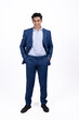 © Midea  - Confident businessman in blue suit standing on white background.