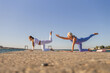 © svetograph - Yoga Beach Fitness Women Stretching Outdoors
