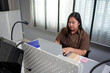 © Kawee - Asian young plus-size businesswoman working in the corporate office.