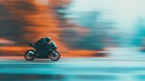 Motorcycle racing on a winding road at dusk with a blurred background
