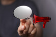 © vegefox.com - A person uses a digital loudspeaker to display a speech bubble, concept about communication, announcements and sharing ideas. Symbolizing inform