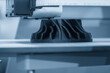 © Pixel_B - Close up scene the 3D model operation by additive manufacturing by 3D printer machine in the blue tone. The high technology manufacturing process by rapid prototype method.