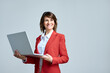 © Stock 4 You - Isolated portrait middle-aged specialist latin hispanic business lady working on laptop pc dreaming looking away. Mature CEO woman in red suit using computer technology for work online. Copy space
