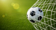 © Rashed - A soccer ball, the primary subject, is captured inside a soccer net