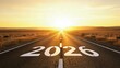 © MOON - Road to 2026 painted on asphalt leading toward a dramatic golden desert sunset, symbolizing the New Year, future journey, goals, and upcoming opportunities.
