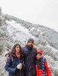 © Antonio Recena - Bearded Father Aged Forty Posing with His Twelve Year Old Daughter and Ten Year Old Son in a Snowy Forest on a Winter Day