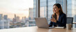 © Five Million Stock - Latin hispanic young business woman working on laptop computer at office desk with city view. Indian entrepreneur manager businesswoman using pc for work, learning at workplace. Banner, copy space