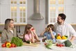 © New Africa - Happy family cooking and having fun together at table in kitchen