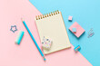 © Pixel-Shot - Different rubber erasers with notebook, pencil, paper clips and sticky notes on color background