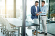 © ReeseFullyOwned/peopleimages.com - Business, men and meeting with documents in office for case preparation, feedback and teamwork. Law firm, lawyers and discussion with folder for legal advice, lawsuit settlement and evidence review