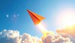 © FACTORY GRAPHICA  - A vibrant orange paper airplane soaring high above the clouds, leaving a trail of light behind