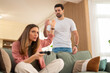 © Dexon Dee - Couple arguing over partner playing video games