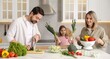 © New Africa - Happy family cooking together at table in kitchen