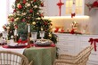 © New Africa - Festive table setting with Christmas decor in kitchen. Space for text