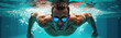 © Viktor - Muscular man swims underwater with blue goggles. Water splashes around him as he moves through pool or ocean. Active man enjoys water sport, training body fitness.