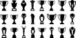 © zephyr - Large collection of black trophy and award silhouettes in various shapes and styles isolated on white background for sports competition achievement and success icons.