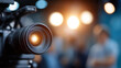 © Denis Yevtekhov - Camera in focus with bright studio lights and crew in background, ideal for photography and videography themes, defocused production team, professional filming environment, with co