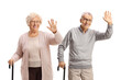 © Ljupco Smokovski - Happy elderly couple with walking canes waving at camera