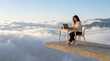 © Rendara Studio - Remote work concept with a woman using a laptop on a floating platform above the clouds