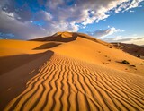 Sunny desert landscape, textured dunes with cloudy sky