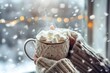 © Natallia - Hands holding warm mug with hot chocolate and marshmallows