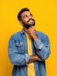 © Johannes - happy joyful smiling young indian man looking aside up thinking of new good opportunities dreaming feeling inspired and proud standing isolated on yellow background portrait no logos no brands ar 34